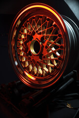 old retro stylish wheels collapsible two-component with a gold center and shiny rims for car tuning long exposure photo to simulate movement