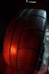 old retro stylish wheels collapsible two-component with a gold center and shiny rims for car tuning long exposure photo to simulate movement