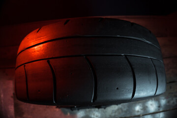 old retro stylish wheels collapsible two-component with a gold center and shiny rims for car tuning long exposure photo to simulate movement