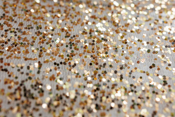 Golden Glitter Bokeh Texture on White Fabric