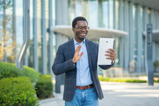 African american man having video call on digital tablet - Powered by Adobe