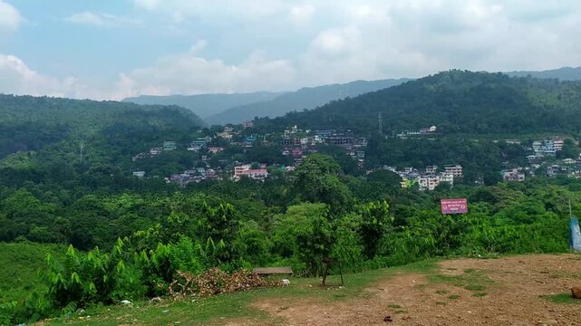 Scenic view of sylhet city surrounded by lush green hills and vegetation