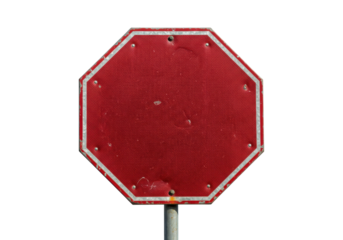 Isolated red stop sign in an octagonal shape, aged and worn from weathering and time, outside
