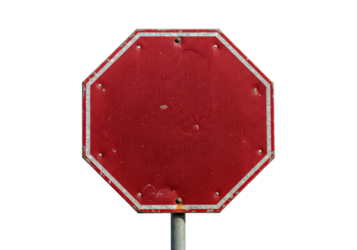 Isolated red stop sign in an octagonal shape, aged and worn from weathering and time, outside