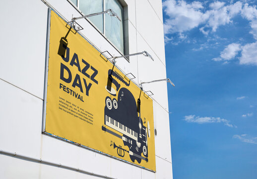 Blank advertising space on a building under a clear blue sky