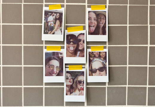 Vertical Instant Prints on a grid wall