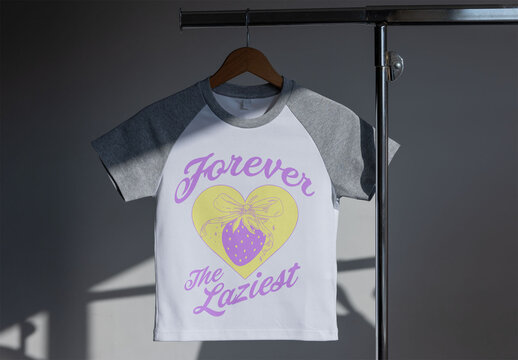 White and gray T-shirt hangs on a rack