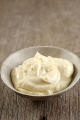Bowl of Cream Cheese on a Rustic Wooden Table