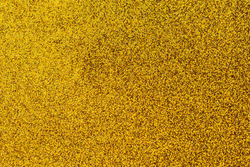 A gold background with a lot of small gold specks