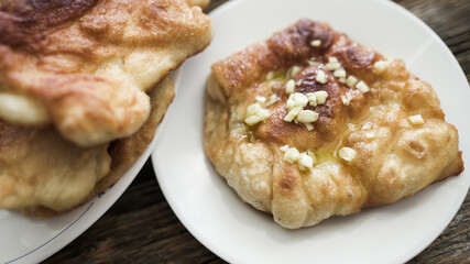 Hungarian langos with garlic and olive oil on plate