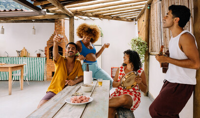 Friends enjoying a lively pagode gathering outdoors on a relaxed Saturday afternoon