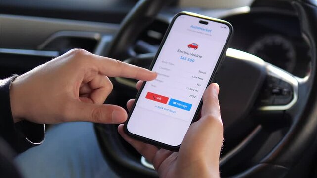An eco-conscious car shoppers hands hold a smartphone displaying a detailed used electric vehicle listing with mileage, specifications, and pricing. 