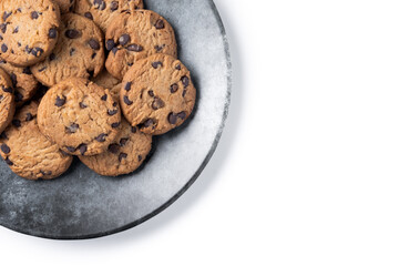 Baked chocolate chip cookies on black plate isolated on white background. Top view. Copy space