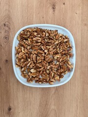 The healthiest nut, hand-picked and dried from an organic plantation. It's suitable for everyone and packed with various beneficial qualities. This nut is called a walnut, and it looks like a brain