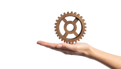 A hand delicately holding a gear, symbolizing industry and process 