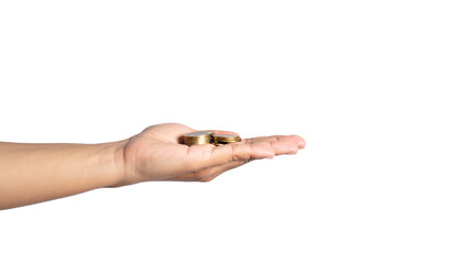 Hand holding golden coins in offering gesture, a symbol of wealth, savings, and financial security