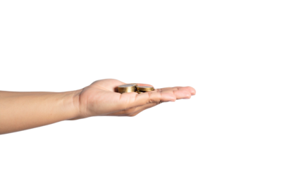 Hand holding golden coins in offering gesture, a symbol of wealth, savings, and financial security