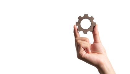 A hand delicately holding a gear, symbolizing industry and process 