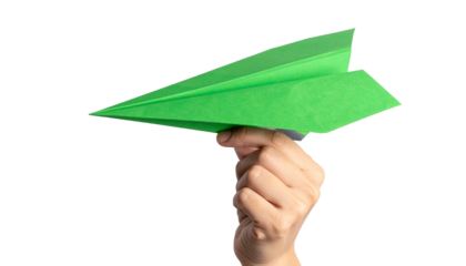 A person's hand holding a green paper airplane, ready to launch into flight. The plane symbolizes dreams, aspirations, and the joy of simple pleasures