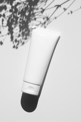 White cream tube mockup, shadow overlay, sunlight