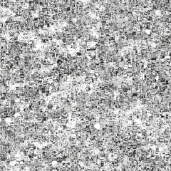Abstract grayscale pattern formed by numerous small, irregular shapes with varied textures, creating a sense of depth and complexity. 