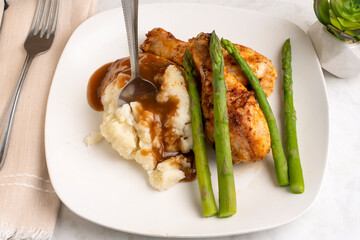 chicken  drumsticks  with asparagus and mashed potatoes