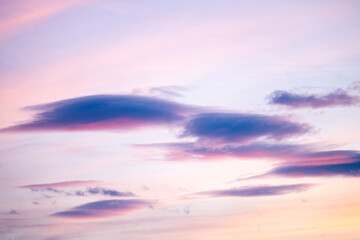 blue sky with purple magenta clouds at sunset