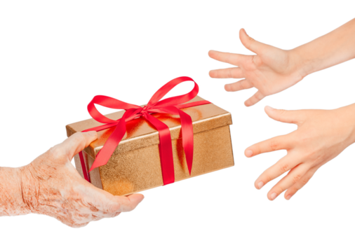 Elderly hand offering a golden gift box with red ribbon to younger hands reaching out, isolated. Symbol of giving, love, care, hope, connection between generations for holiday, family concepts.