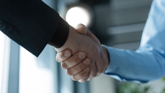 Partnership, teamwork and shaking hands for agreement, consulting or introduction in meeting
