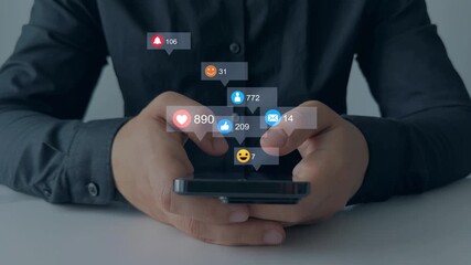 Man using smart phone with emoticon icons of Social Media.Interactive with friends on chat with emoticon feedback.Social media,marketing, like,social network,blog,live,chat reaction and livestream - Powered by Adobe
