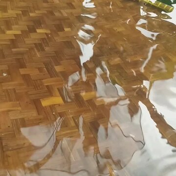 Unique Water Reflection of Satellite Dish on Woven Bamboo