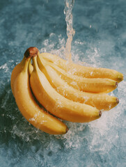 Fresh Bananas Splashing in Water on Blue Background for Healthy Food Concept