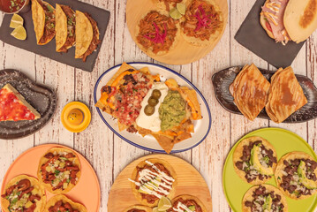 Traditional Mexican nachos with crispy tortilla chips, melted cheddar cheese, sliced ​​jalapeños, and refried beans