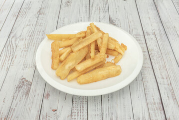 Crispy-on-the-outside, fluffy-on-the-inside fried yuca, served with cilantro, garlic, and lemon mojo sauce for dipping