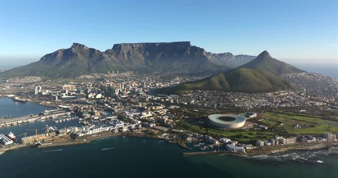 Aerial drone shot approaching Cape Town city in Western Cape, South Africa.	
