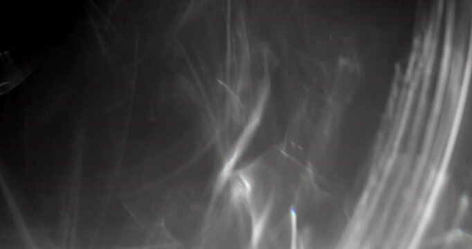 Caustic reflections on black background. Can be used as overlay elements for your projects, video texture or background for designs, scenes, etc. 