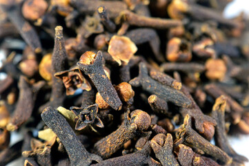 Closeup of Clove, an aromatic spice derived from the dried flower buds of the Syzygium aromaticum tree, used to flavor a variety of foods, as well as in perfumes and toothpaste