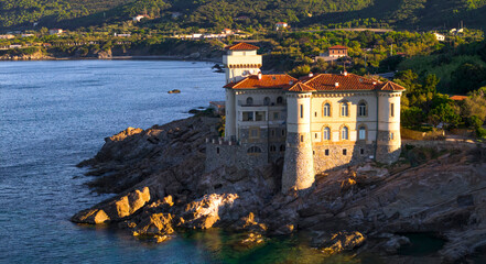 one of the most beautiful and romantic castles in Italy - Castello di Boccale located on the rocks of Tyrrenean sea near Livorno in Tuscany