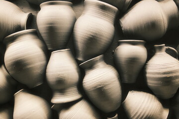 Many handmade pots and jugs of different shapes and sizes are grouped together.