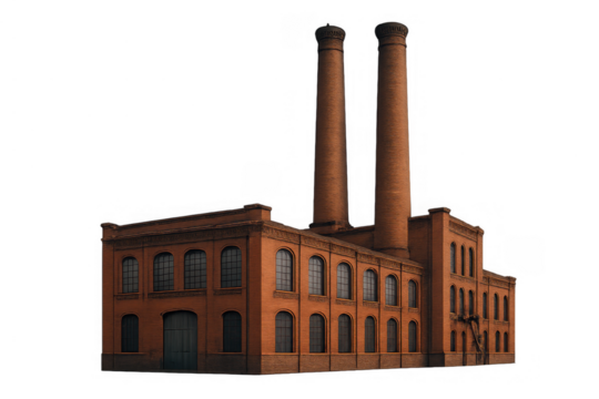 Old industrial brick factory building with two smokestacks, representing historical production and energy