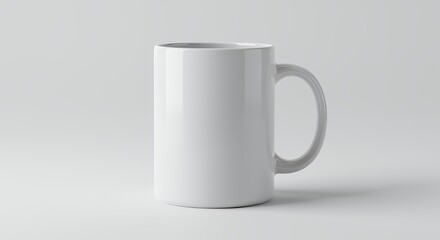 Fototapeta premium White ceramic mug with handle on white background.
