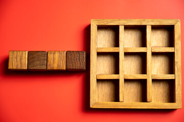 Row of wooden square cubes on colored background. Template or Copy space