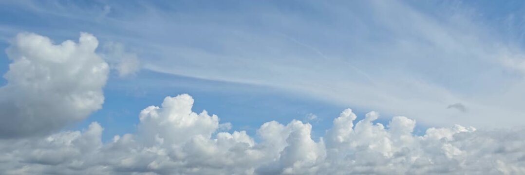 Cloudscape, a Timelapse of Bright cumulus clouds under layered blue sky with dynamic texture for background, for a background	
