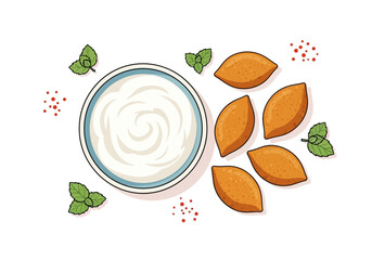 Overhead view of a bowl of creamy yogurt with kibbeh and mint leaves.