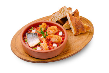 Delicious seafood stew served with fresh bread on a wooden platter