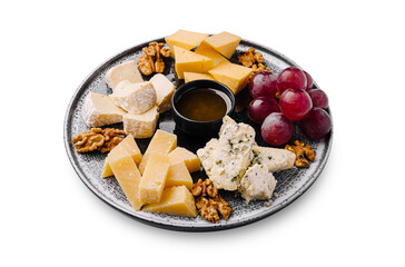 Cheese and fruit platter with nuts arranged on a decorative plate