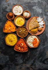 group of Indian Sweet or mithai in terracotta bowl, selective focus