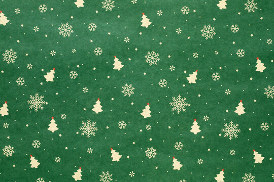 Green Christmas background with snowflakes and christmas trees,seamless pattern of christmas trees and snowflakes on green background,Christmas wrapping paper, Xmas pattern with ornaments.