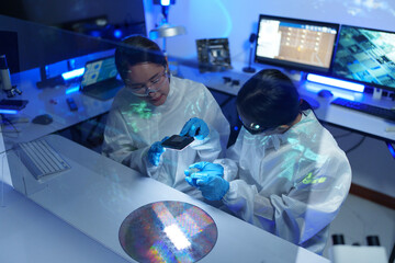 Technician working on analyzing semiconductor or microchip boards, electronics industry, electronic engineer, computer technology, CPU maintenance, hardware, motherboard component upgrades.