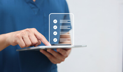 close up young general practitioner hand use stylus pen to check box on medical chekclist or opd record to read and diagnose and assess about patient's symptom for healthy and lifestyle concept